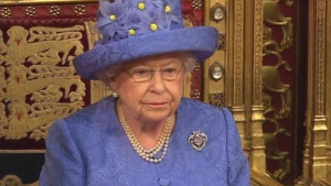 Queen Elizabeth II delivering a speech in Parliament.